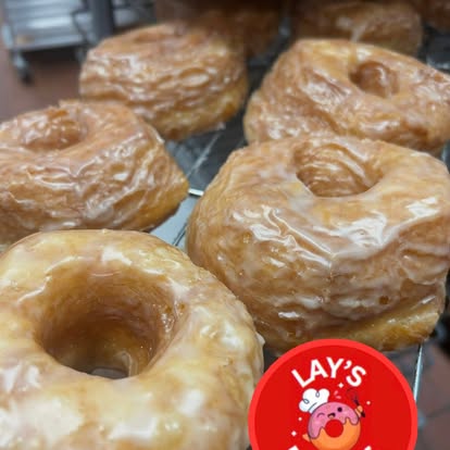 Fresh glazed cronuts on the cooling rack