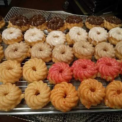 Tray of iced cake donuts in assorted flavors